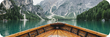 Wooden boat on a mountain lake