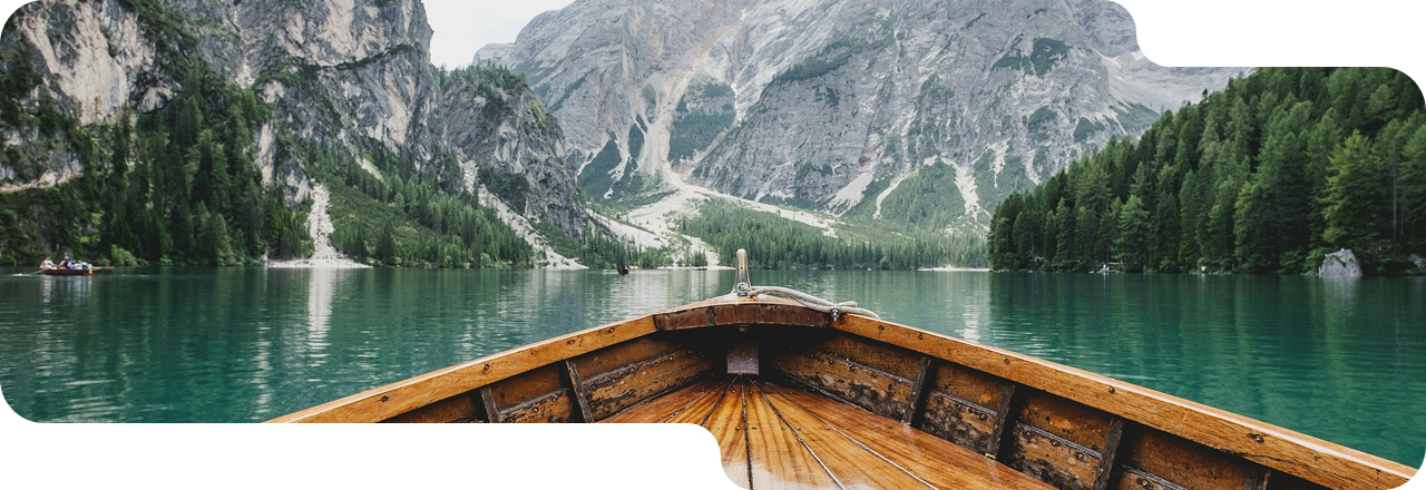 Wooden boat on a mountain lake